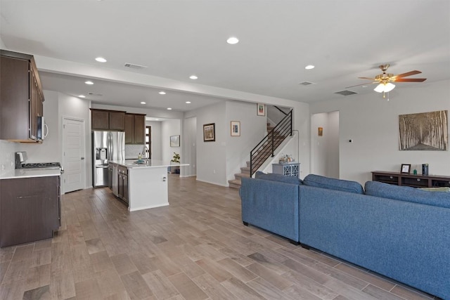 11717 Reindeer Dr, Austin, TX 78754 - living area with recessed lighting, light wood-type flooring, stairs, and ceiling fan