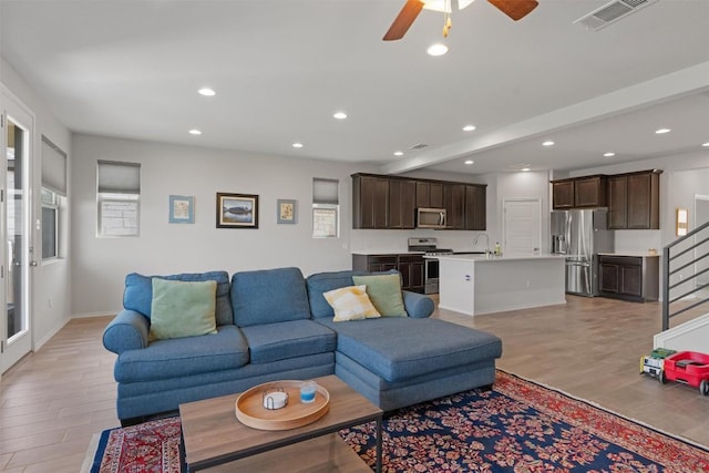 11717 Reindeer Dr, Austin, TX 78754 - living room featuring light wood-style flooring, ceiling fan, and recessed lighting