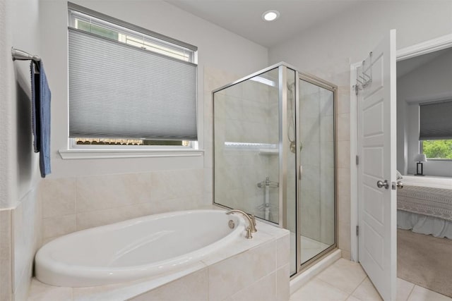 11717 Reindeer Dr, Austin, TX 78754 - bathroom featuring a bath, ensuite bathroom, a shower stall, and tile patterned flooring