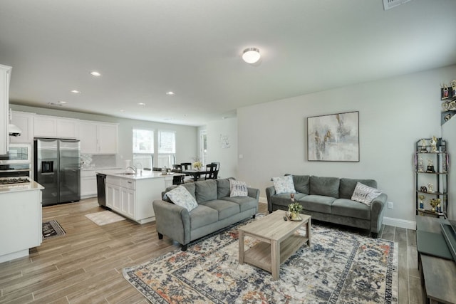 217 Stone Creek Dr, Georgetown, TX 78628 - living area featuring recessed lighting and light wood-type flooring