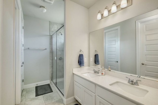 217 Stone Creek Dr, Georgetown, TX 78628 - bathroom with double vanity, a stall shower, and tile patterned floors
