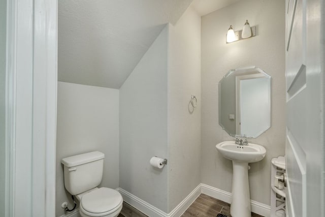 217 Stone Creek Dr, Georgetown, TX 78628 - half bath featuring wood finished floors and vaulted ceiling
