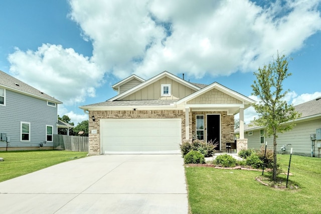 217 Stone Creek Dr, Georgetown, TX 78628 - craftsman inspired home with board and batten siding, brick siding, a garage, and driveway