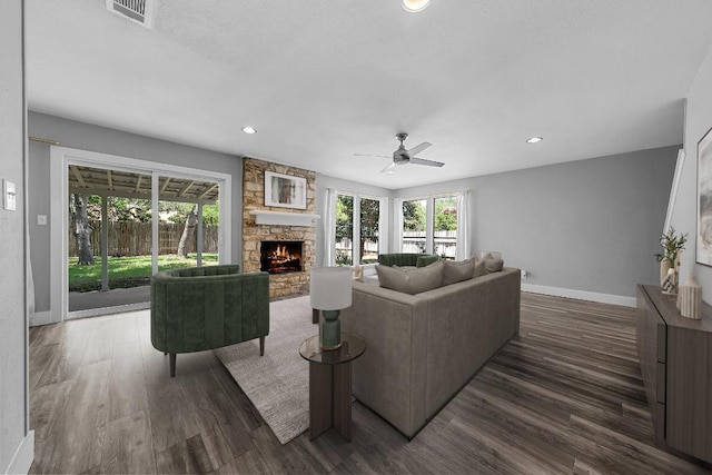 4904 Wing Rd, Austin, TX 78749 - living area with a fireplace, wood finished floors, a ceiling fan, and recessed lighting