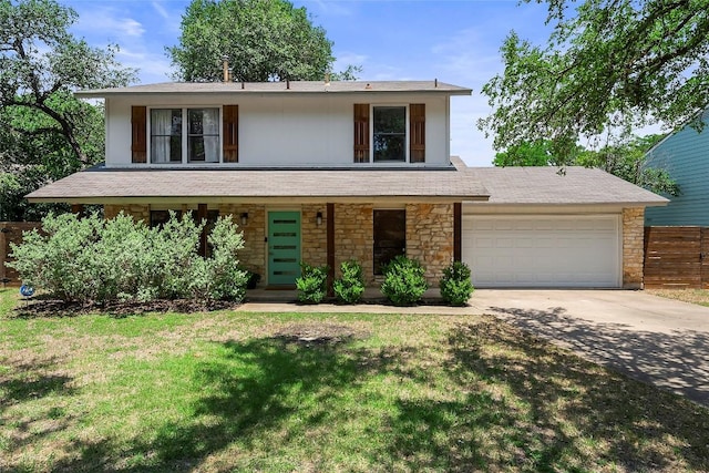 4904 Wing Rd, Austin, TX 78749 - view of front of house with stone siding, an attached garage, driveway, and covered porch