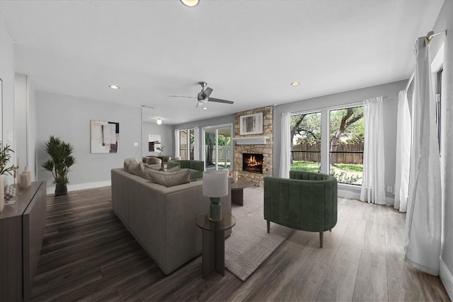 4904 Wing Rd, Austin, TX 78749 - living room with a stone fireplace, wood finished floors, plenty of natural light, recessed lighting, and a ceiling fan