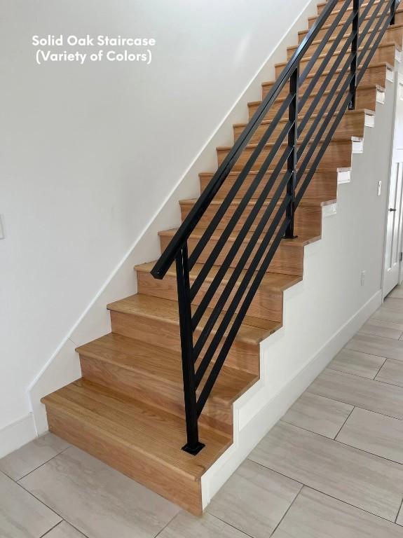 300-304 Tesla Cir, Austin, TX 78681 - stairway featuring baseboards and tile patterned flooring