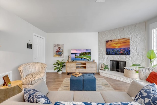 200 Free Rein Unit 5, Horseshoe Bay, TX 78657 - living room featuring a fireplace and wood finished floors