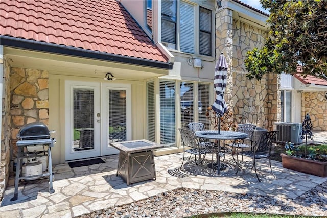 200 Free Rein Unit 5, Horseshoe Bay, TX 78657 - view of patio featuring french doors and area for grilling