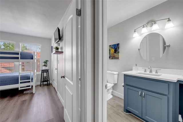 200 Free Rein Unit 5, Horseshoe Bay, TX 78657 - bathroom with vanity and wood finished floors