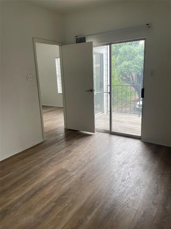 12166 Metric Blvd Unit 243, Austin, TX 78758 - unfurnished room featuring wood finished floors and baseboards