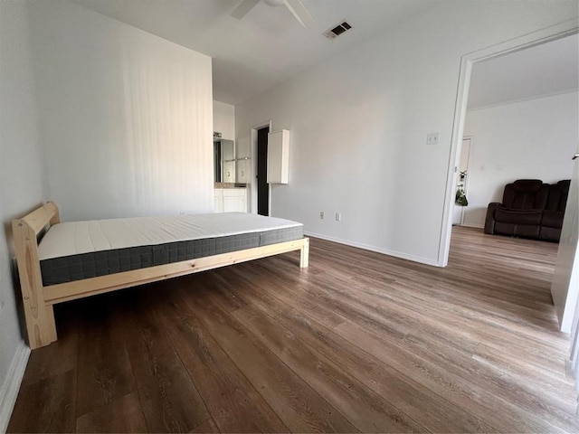 12166 Metric Blvd Unit 243, Austin, TX 78758 - bedroom featuring wood finished floors and ceiling fan
