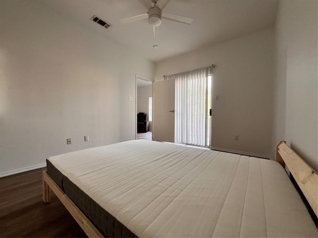 12166 Metric Blvd Unit 243, Austin, TX 78758 - bedroom with dark wood-type flooring and ceiling fan