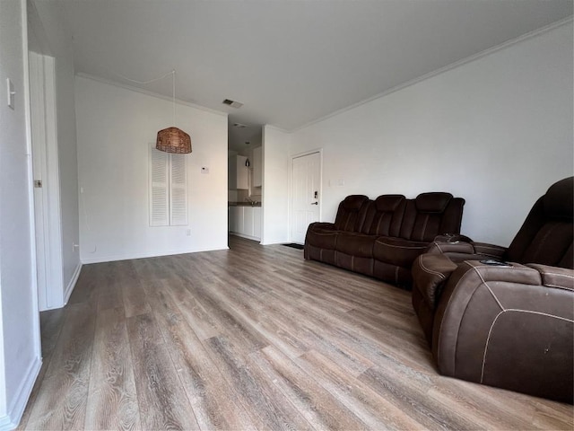12166 Metric Blvd Unit 243, Austin, TX 78758 - living area featuring wood finished floors and crown molding