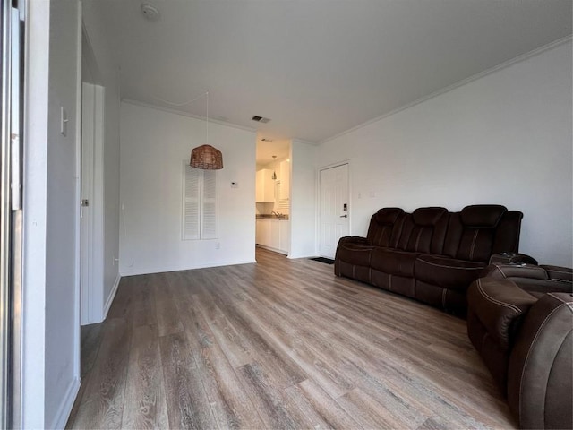 12166 Metric Blvd Unit 243, Austin, TX 78758 - living room featuring ornamental molding and wood finished floors