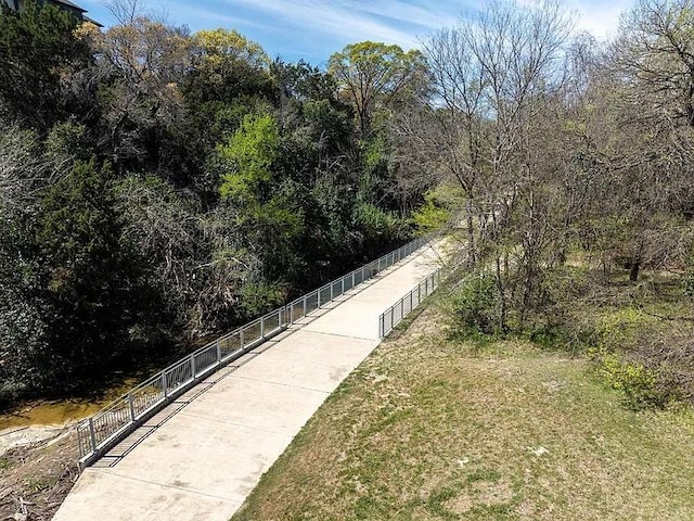 12166 Metric Blvd Unit 243, Austin, TX 78758 - view of property's community with a lawn and a wooded view
