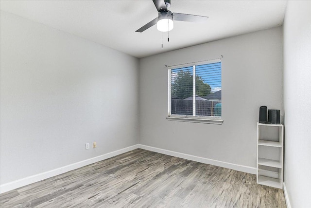 1000 Warbler Cv, Hutto, TX 78634 - unfurnished room featuring wood finished floors and a ceiling fan