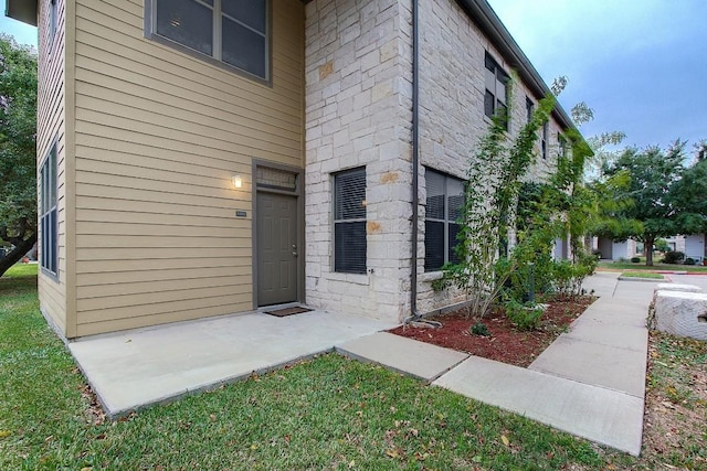 1201 Grove Blvd Unit 1404, Austin, TX 78741 - property entrance featuring stone siding