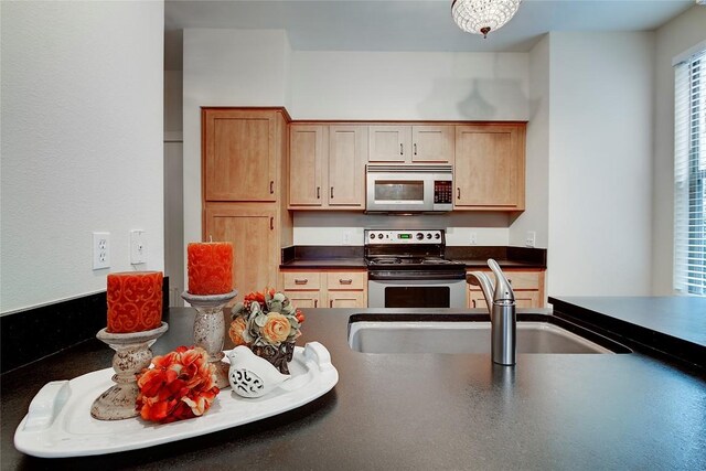 1201 Grove Blvd Unit 1404, Austin, TX 78741 - kitchen featuring electric range oven and dark countertops