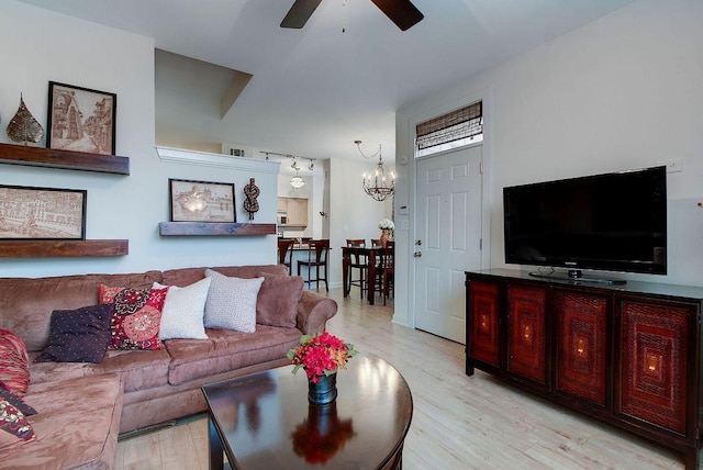 1201 Grove Blvd Unit 1404, Austin, TX 78741 - living room with ceiling fan, a chandelier, and light wood finished floors