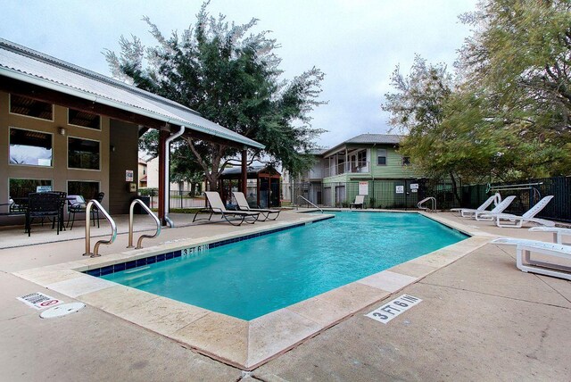 1201 Grove Blvd Unit 1404, Austin, TX 78741 - community pool featuring a patio area