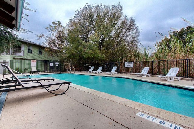 1201 Grove Blvd Unit 1404, Austin, TX 78741 - community pool featuring a patio