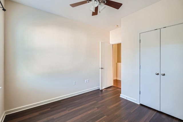 1201 Grove Blvd Unit 1404, Austin, TX 78741 - unfurnished bedroom featuring dark wood finished floors, a closet, and a ceiling fan