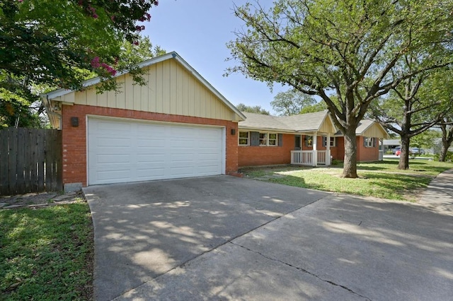 2710 Greenlawn Pkwy, Austin, TX 78757 - single story home with concrete driveway, brick siding, and an attached garage