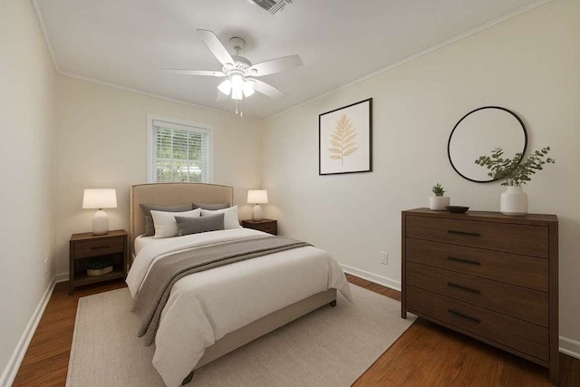 2710 Greenlawn Pkwy, Austin, TX 78757 - bedroom featuring crown molding, wood finished floors, and a ceiling fan