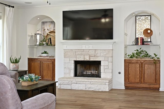 1903 Chula Vista Dr, Cedar Park, TX 78613 - living area featuring wood finished floors, ornamental molding, and a stone fireplace