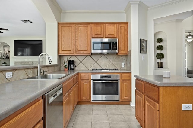 1903 Chula Vista Dr, Cedar Park, TX 78613 - kitchen featuring stainless steel appliances, ceiling fan, tasteful backsplash, light tile patterned floors, and ornamental molding
