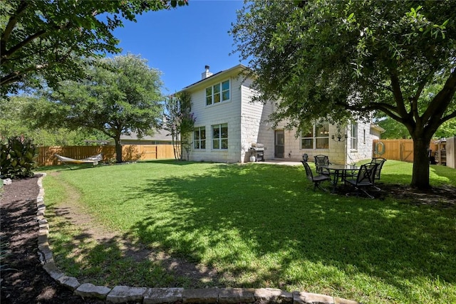 1903 Chula Vista Dr, Cedar Park, TX 78613 - rear view of property with a fenced backyard and a chimney