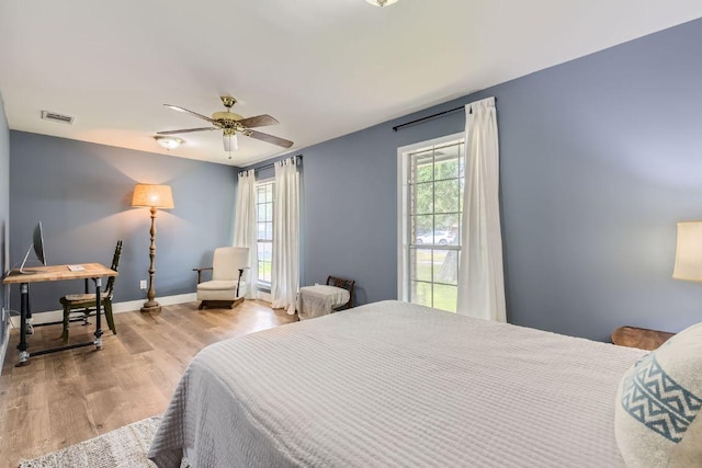 13223 Broadmeade Ave, Austin, TX 78729 - bedroom with wood finished floors and ceiling fan