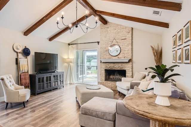 13223 Broadmeade Ave, Austin, TX 78729 - living room featuring a chandelier, light wood-type flooring, beamed ceiling, high vaulted ceiling, and a fireplace