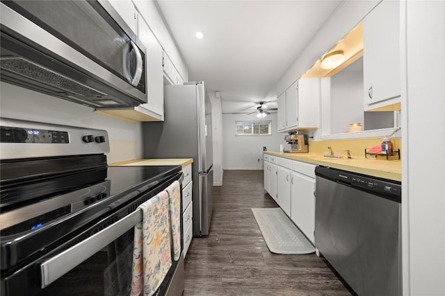 2016 Wanda St, Copperas Cove, TX 76522 - kitchen with stainless steel appliances, light countertops, white cabinets, ceiling fan, and dark wood-style flooring