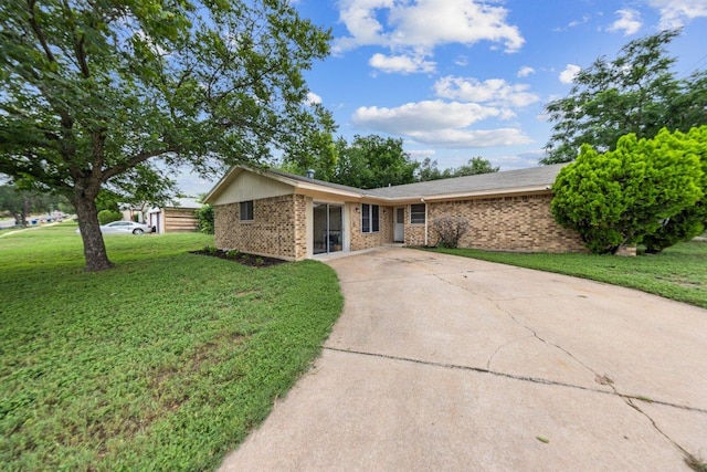 2016 Wanda St, Copperas Cove, TX 76522 - single story home with a front lawn, concrete driveway, and brick siding