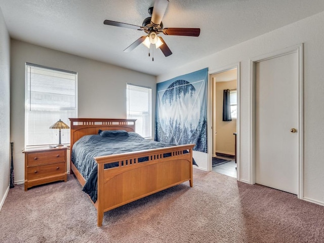 4503 Lori Dr, Killeen, TX 76549 - carpeted bedroom with connected bathroom and ceiling fan