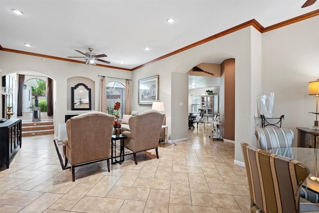 700 Canyon Bend Rd, Pflugerville, TX 78660 - living area featuring ceiling fan, arched walkways, ornamental molding, and recessed lighting