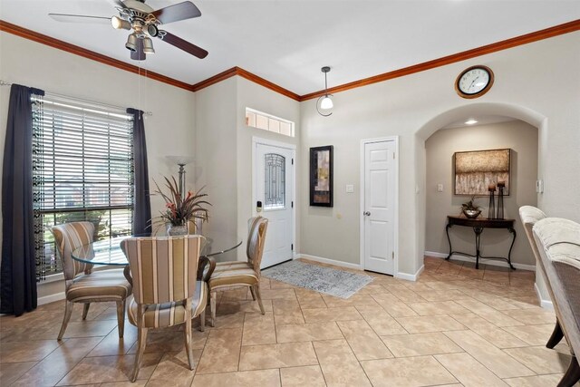 700 Canyon Bend Rd, Pflugerville, TX 78660 - dining room with ornamental molding, a ceiling fan, and arched walkways