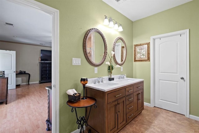 700 Canyon Bend Rd, Pflugerville, TX 78660 - bathroom with double vanity and baseboards