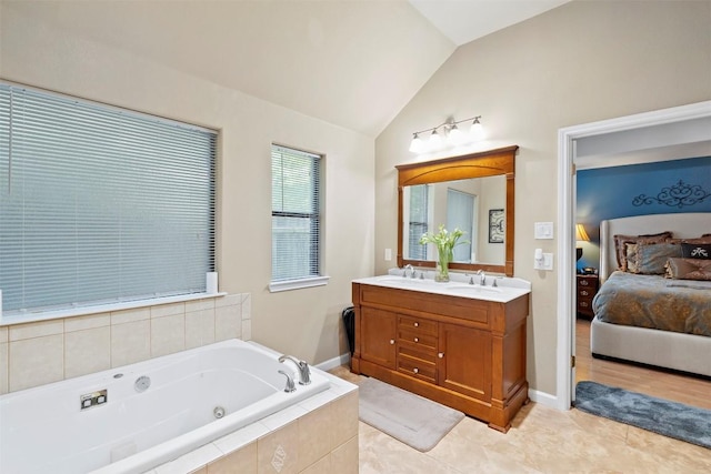 700 Canyon Bend Rd, Pflugerville, TX 78660 - full bathroom with double vanity, ensuite bath, a jetted tub, lofted ceiling, and tile patterned flooring