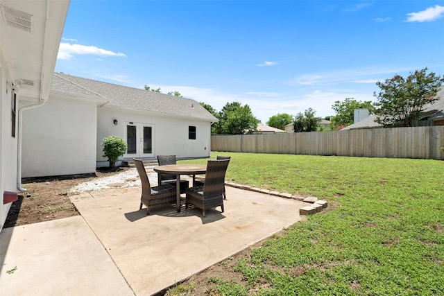 700 Canyon Bend Rd, Pflugerville, TX 78660 - fenced backyard featuring french doors and a patio area