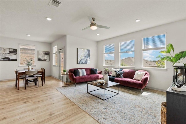 10708 Defender Trl, Austin, TX 78754 - living room featuring healthy amount of natural light, light wood finished floors, ceiling fan, and recessed lighting