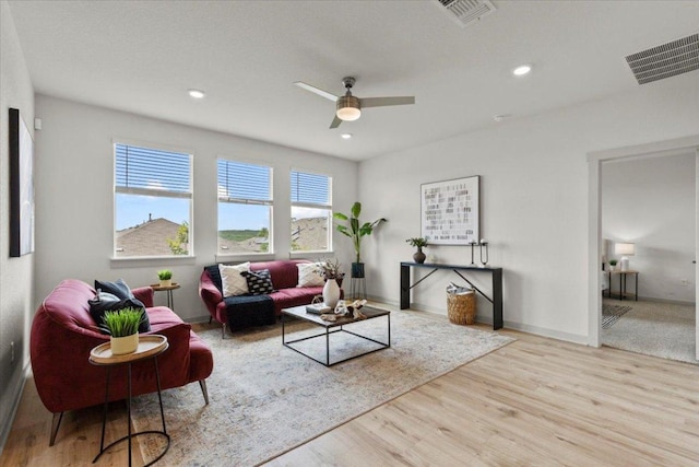 10708 Defender Trl, Austin, TX 78754 - living area featuring a ceiling fan, wood finished floors, and recessed lighting