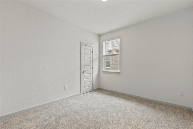 10708 Defender Trl, Austin, TX 78754 - carpeted empty room with baseboards