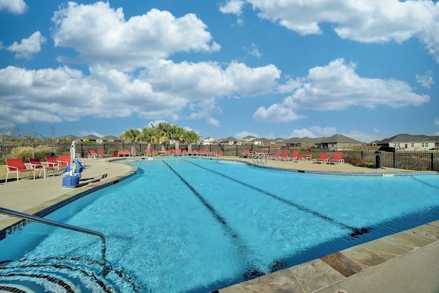 12908 Thomas Jefferson St, Manor, TX 78653 - community pool featuring a patio area and a residential view