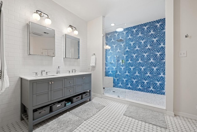 3702 Terrina St Unit 12, Austin, TX 78759 - bathroom with double vanity, walk in shower, and tile walls
