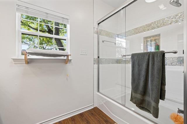 3702 Terrina St Unit 12, Austin, TX 78759 - bathroom with enclosed tub / shower combo and wood finished floors