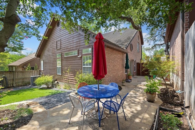 3702 Terrina St Unit 12, Austin, TX 78759 - rear view of house featuring a patio area, a fenced backyard, and outdoor dining area