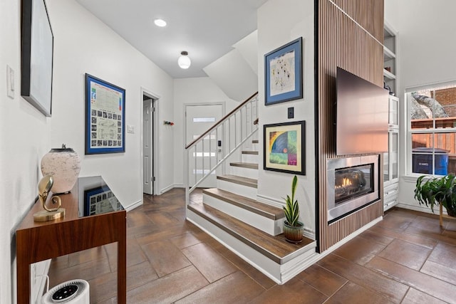 3702 Terrina St Unit 12, Austin, TX 78759 - staircase with a glass covered fireplace and recessed lighting
